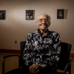 Edith Renfrow Smith ’37, the first black woman to graduate from Grinnell, pictured in the newly rededicated Smith Gallery in the JRC Oct. 29, 2021. At the time of the photo she was 107 and the oldest living alum. (Photo by Justin Hayworth/Grinnell College)
